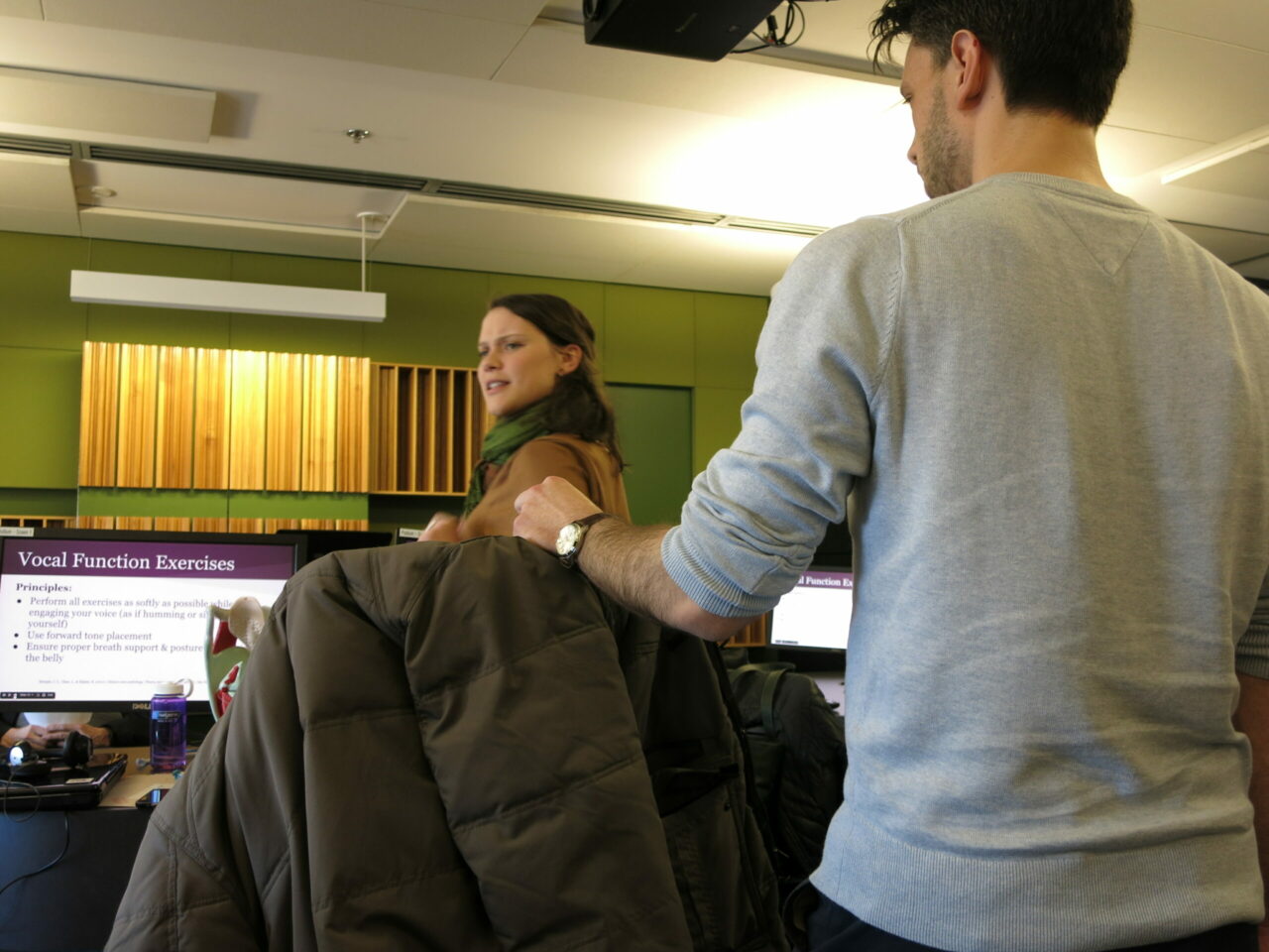 Students John Yotakis and Susan Janzen answering participant questions during 