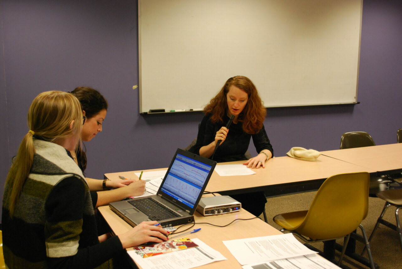 Students Cristina Stanescu and Marla Vincente screening a participant in the McGill Education Building. (Photo: Leah MacQuarrie)