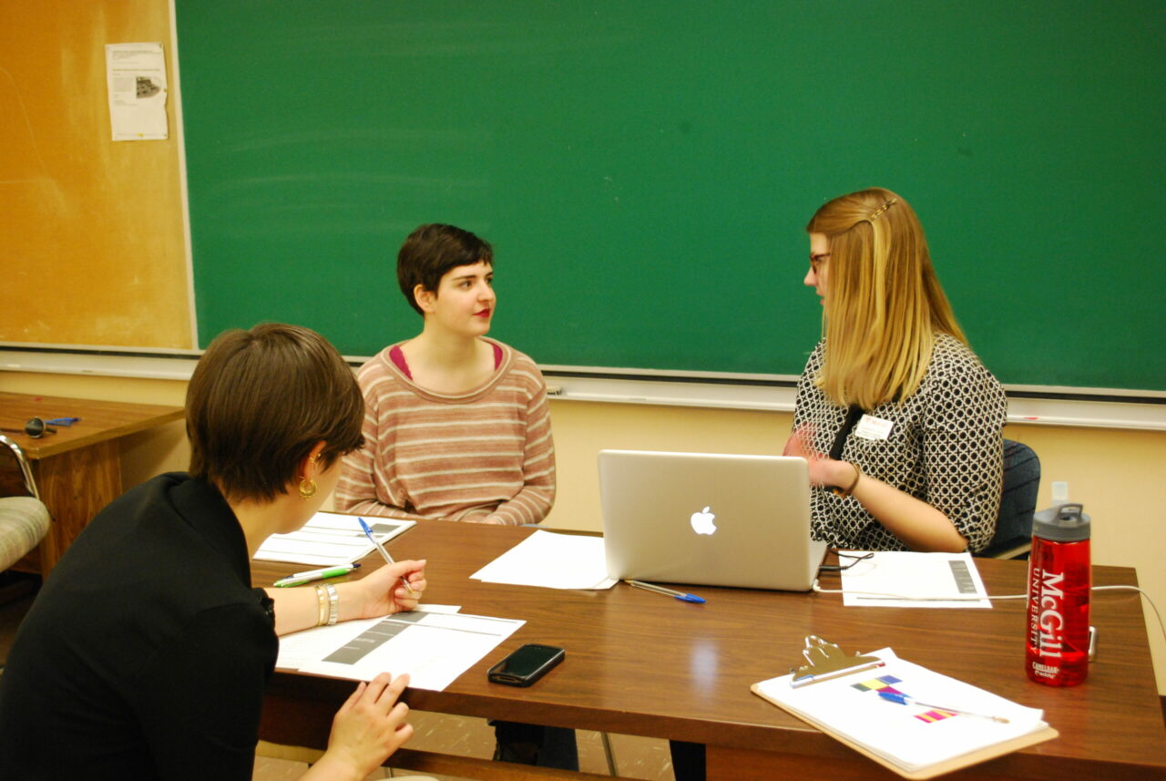 Students Cassandra Groot and Suzy Read discussing voice measures with a participant. (Photo: Leah MacQuarrie)