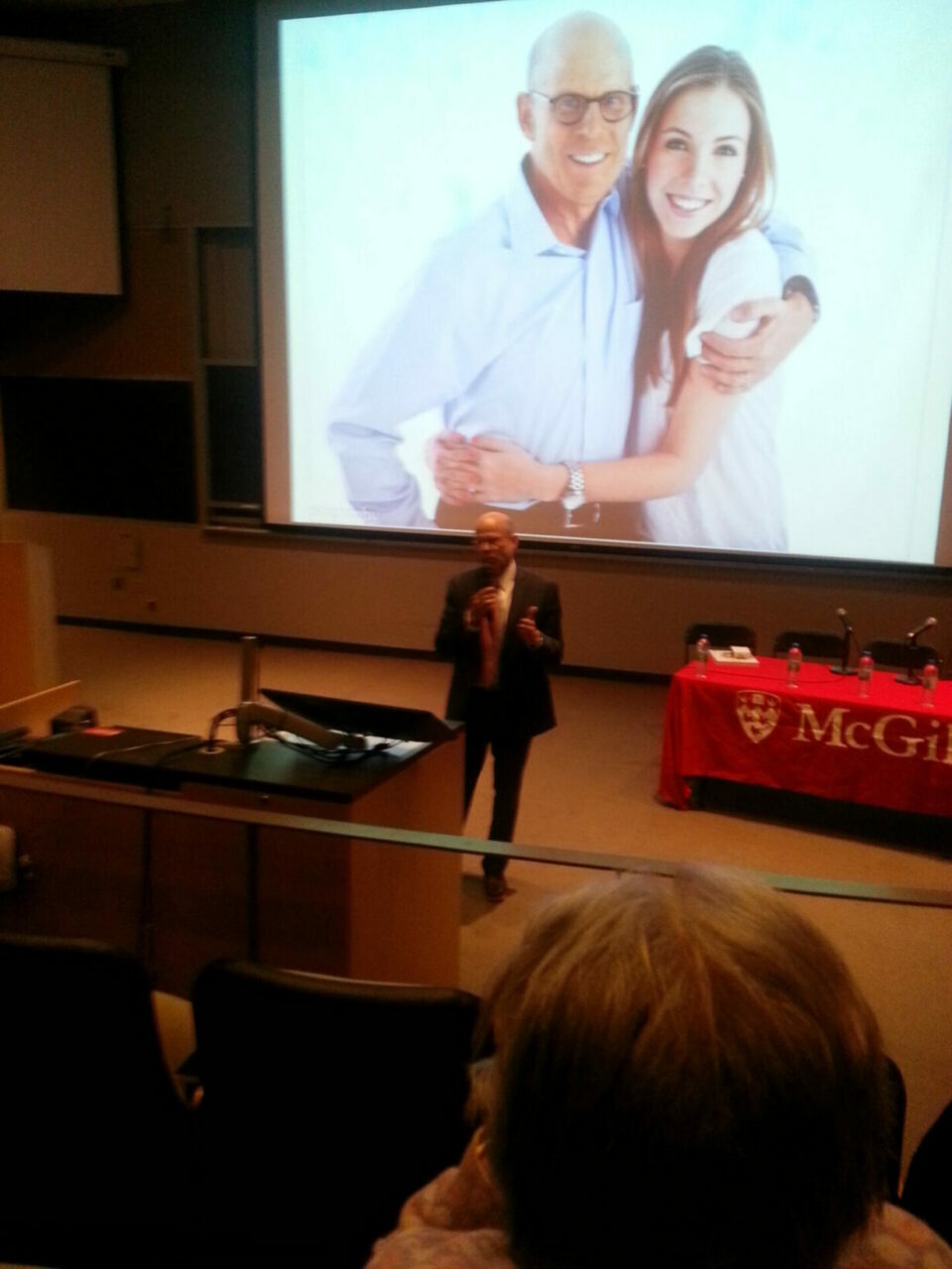 William Brock, BCom’77, BCL’78, LLB’80, closed the evening with an eloquent testimonial, told in six family photos, of how past supporters of cancer research had made it possible for him to see his children, including recent McGill grad, Julianne Brock, BCom'15, into adulthood. Photo: Annette Novak