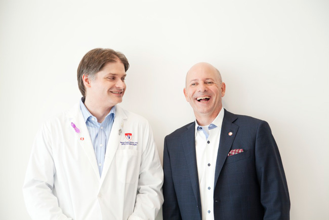 Dr. Georges Zogopoulos (left) and Serges Bériault share a happy moment recently. / Photo: Rachel Côté Photographer and to the Cancer Research Society