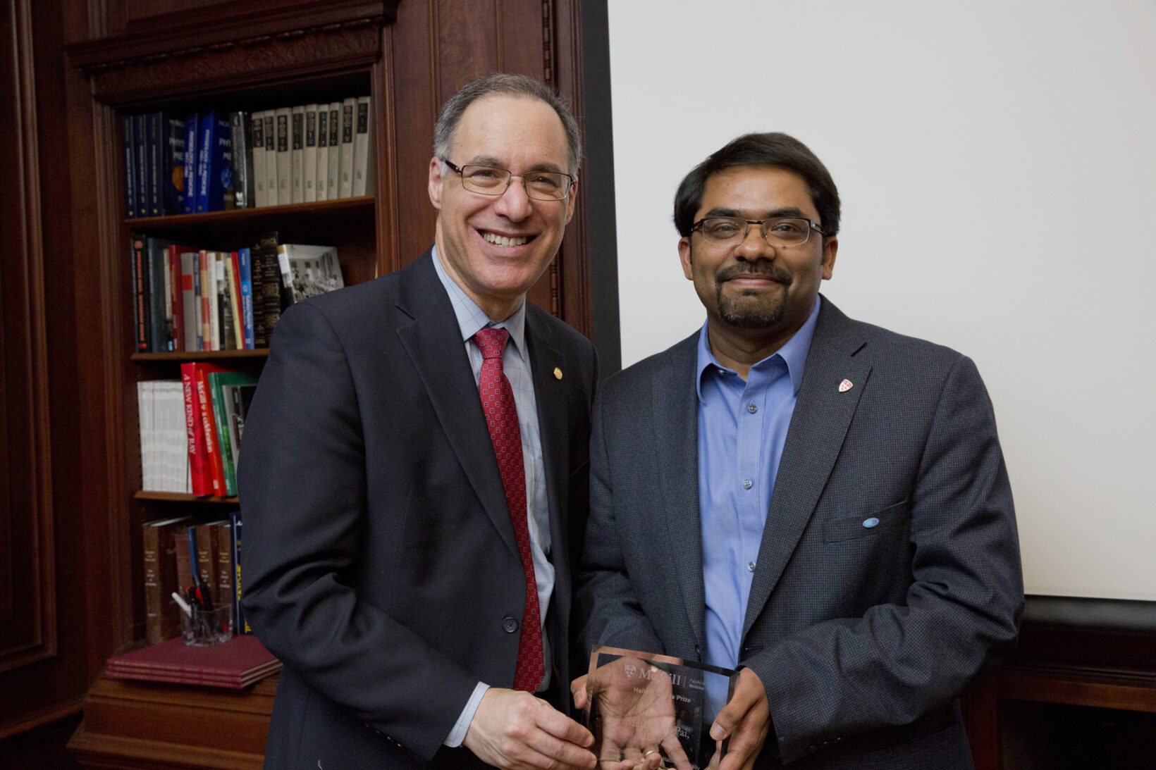 Dr. Madhukar Pai (right), 2015 winner of the Haile T. Debas prize, with Dr. David Eidelman, Vice-Principal (Health Affairs)  and Dean, Faculty of Medicine. (Photo: Nicolas Morin)